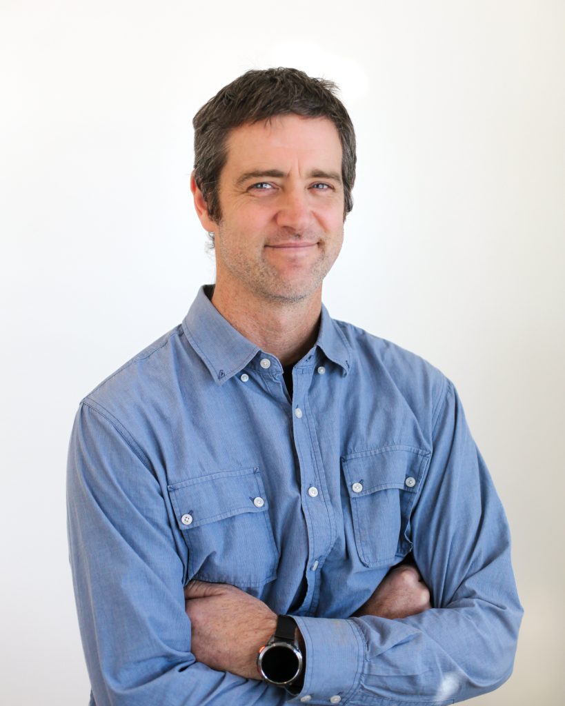 Portrait of man with arms crossed